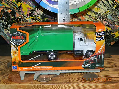 2019 New Ray-1:43 Scale White Peterbilt 335 Long Haul Trucker Toy Garbage Truck - Image 1 of 4