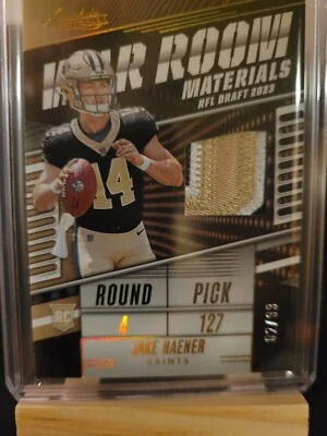 2023 Panini Absolute Jake Haener Rookie RC War Room Mat. Patch Gold 02/99  - Image 1 of 3