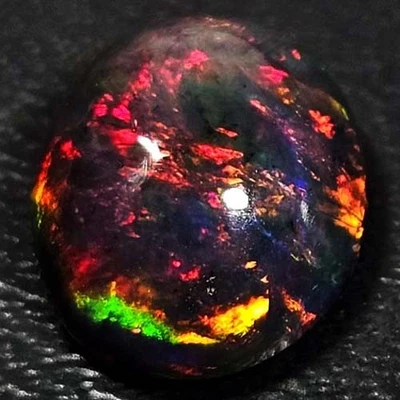 NATURAL AAA+ FULLFIRE COLORPLAY OVAL CABOCHAN  ETHIOPIAN WELO BLACK OPAL 1.60CTS - Image 1 of 3