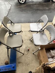 Four Heavy Duty Steel Folding Chairs