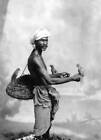 Hindu holding birds in his hands in India Historic Old Photo