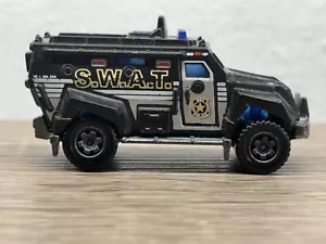2011 MATCHBOX S.W.A.T. TRUCK black 1:64 DIECAST 2 3/4" POLICE VEHICLE - Picture 1 of 7