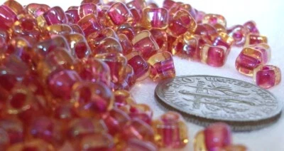 5/0 Amber Fuchsia Colorlined Miyuki Glass Triangle Beads 1.5mm hole TR5-1163 - Image 1 of 2