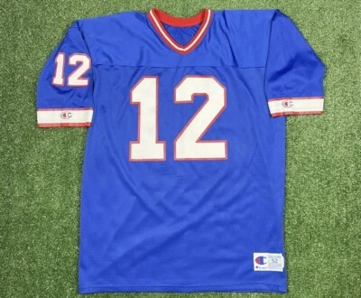 Camiseta de fútbol Jim Kelly #12 campeón de los Buffalo Bills auténtica corte talla 52 nueva en caja Foto 1 de 4