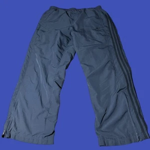 Pantalones cortavientos Adidas Clima365 con cremallera al tobillo para hombre L negro malla forrada cordón - Imagen 1 de 10