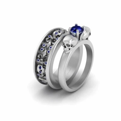 Conjunto de banda de anillo de compromiso de calavera a juego de zafiro azul creado para pareja de anillos de calavera Foto 1 de 4