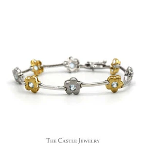 7 1/4 Inch Two Tone Flower Bar Link Bracelet with Blue Topaz Accents in 14k Whit - Picture 1 of 3