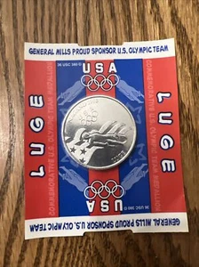 GM Cereal Premium 1998 Moneta commemorativa OLIMPICS (sigillata su carta) SLITTINO - Foto 1 di 2