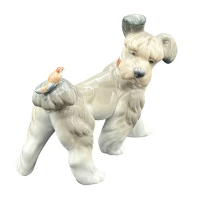 Statuina porcellana Lladro cane con uccellino E 57 H1 fatta a mano in Spagna da collezione - Foto 1 di 14