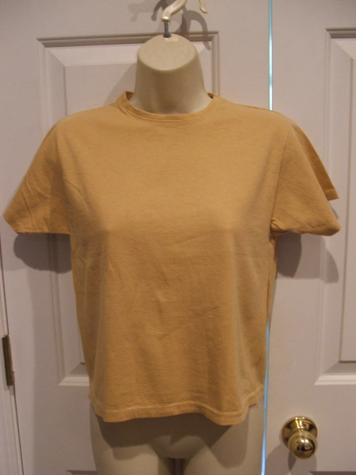 Top manga corta 100% algodón oro amarillo newport news nunca usado xsmall Foto 1 de 1
