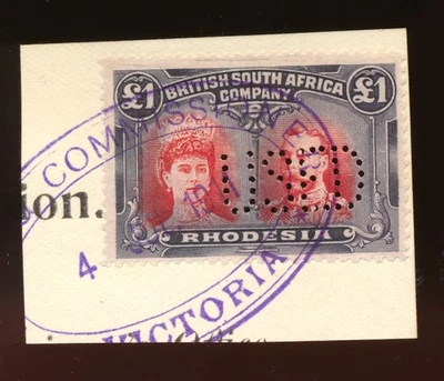 RHODESIA BSAC 1910 CABEZAS DOBLES £1 P14 USADO EN PIEZA COMO FISCAL EN VICTORIA A491 Foto 1 de 2