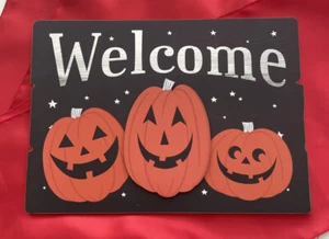 Decoración de puerta de bienvenida de Halloween 14 X 10 calabazas negras y naranjas - Imagen 1 de 3