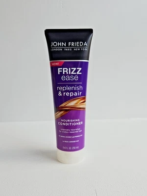 ACONDICIONADOR NUTRITIVO John Frieda Frizz Ease Reponer y Reparar 8,45 fl oz Foto 1 de 2