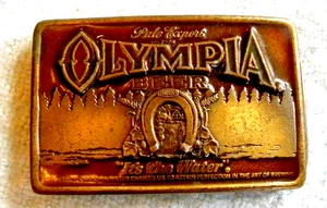VTG 1977 OLYMPIA BEER BREWING CO BRASS ADVERTISING BELT BUCKLE OLYMPIA-ST PAUL - Picture 1 of 2