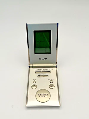 Sharp Travel Alarm Clock Silver & Gold Foldable Ultra-Slim Compact Backlit LCD - Image 1 of 4