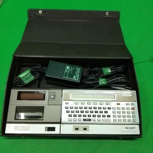Ordinateur de poche SHARP CE-150 avec boitier testé état de fonctionnement - Photo 1/12