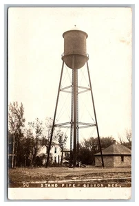 GIBBON NEBRASKA RPPC ~ Water tower , "Stand Pipe" Street view La Barre ~ - Picture 1 of 2