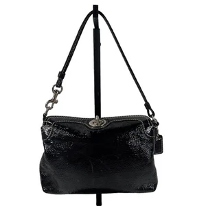 Mini bolso de mano Coach vintage de charol negro con bloqueo giratorio superior - Imagen 1 de 16