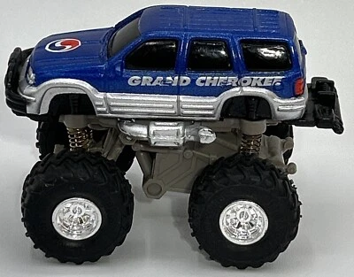 VTG Funline Stampeders Grand  Cherokee Monster Truck Toy Car - Image 1 of 4