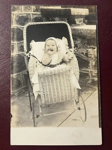 Laughing Baby in Wicker Carriage Real Photo Postcard RPPC - Picture 1 of 3