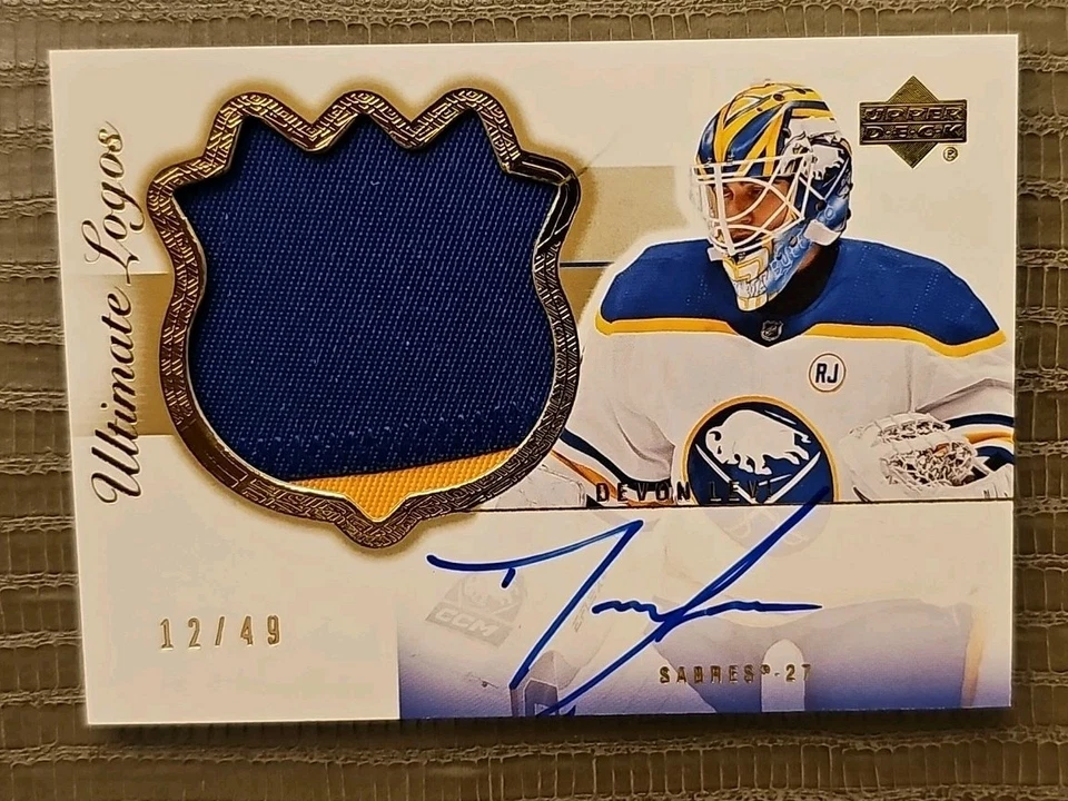 DEVON LEVI 2023-24 Ultimate 🚨 03-04 Rookie Retro Material Signatures Gold 12/49 - Image 1 of 3