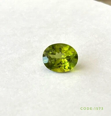 GEMSTONE:PERIDOT-MYANMAR, SHAPE:OVAL, Certified PRODUCT OF THAILAND - Image 1 of 2
