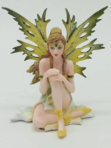 Sitting Green and Yellow Fairy with Ponytail and Braids Collectible Figurine - Picture 1 of 5