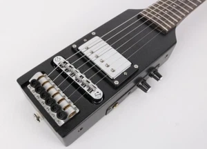 Guitarra Eléctrica Silenciosa de Viaje Ultra Corta Escala Longitud Sin Cabeza Portátil - Imagen 1 de 10