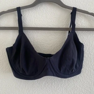 SKIMS Talla 34 DD - SE ADAPTA A TODOS - SUJETADOR DEMI SIN FORRO EN ONYX - Imagen 1 de 7