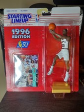 NIP 1996 EDITION STARTING LINEUP SEAN ELLIOTT W/CARD NMT