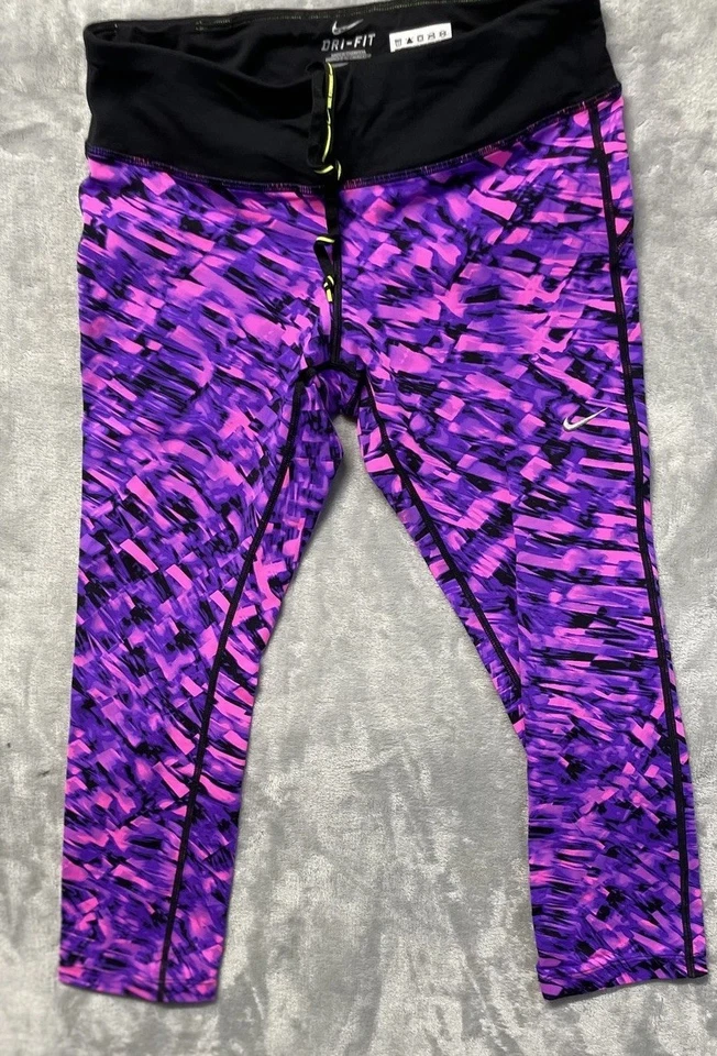 Calça atlética reflexiva Nike Dri-FIT Running Capris feminina bolso médio com zíper - Imagem 1 de 4