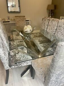 8 seater chrome & glass top dining room table and grey velvet chairs. Immaculate