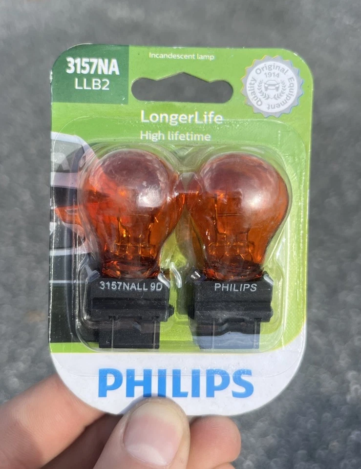 Philips LongerLife 3157NA 27/7W Dos Bombillas Señal de Giro Frontal Aparcamiento Reemplazo Lámpara Foto 1 de 2