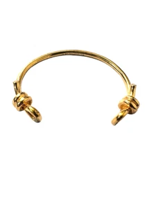 Hermoso brazalete Henri Bendel bronce con detalle de nudo - Imagen 1 de 3