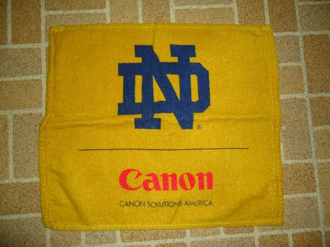 VINTAGE ADVERTISING HAND TOWEL CANON CAMERA & FIGHTING IRISH NOTRE DAME FOOTBALL Cover