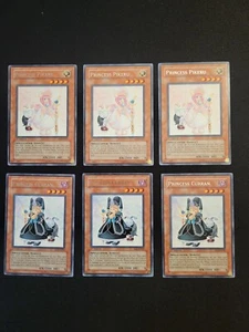 YuGiOh 3 x 1a Edizione Principessa Pikeru SOI-EN027 & 3 x Principessa Curran SOI-EN028 Rara - Foto 1 di 20