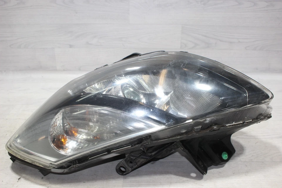 Frontscheinwerfer Halter gebroche links 7701072008 Renault Clio III BK/K85 Bj,09 - Bild 1 von 4