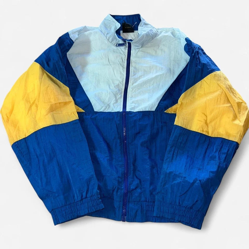 Chaqueta cortavientos juvenil L Puma azul y amarillo Foto 1 de 4