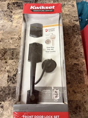 Juego de cerraduras de puerta delantera Kwikset Foto 1 de 3