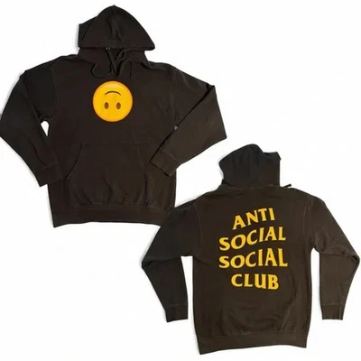 Sudadera con Capucha Anti Social Social Club ASSC 'HMU' Cara Smiley Amarilla sobre Negra Foto 1 de 4