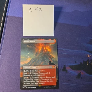 MTG 1x Mount Doom x1 LTR 343 Extended Art NM (2 verfügbar) Borderless - Bild 1 von 6