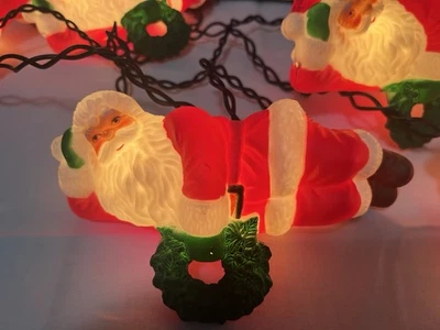 Cadena de luces vintage de 5 Papá Noel perezoso sosteniendo una corona 6+ pies Largo, probado Foto 1 de 4