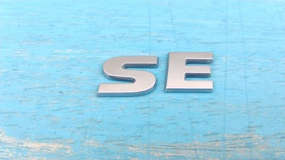 Volkswagen SE багажник эмблема буквы значок наклейка логотип Routan Jetta OEM подлинный - Изображение 1 из 2