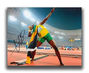 USAIN BOLT HAND SIGNED 10X8 PHOTO - OLYMPICS AUTOGRAPH - JAMAICA. - Picture 1 of 1