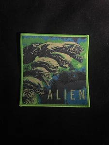 Toppa tessuto alieno classica film anni 80 bordo verde - Foto 1 di 2
