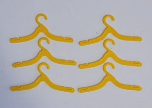 MATTEL vintage BARBIE & KEN DOLL Plastic YELLOW Fashion Outfit CLOTHES HANGERS - Picture 1 of 3