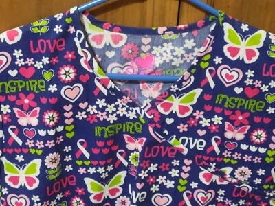 NWT -  PINK RIBBON & BUTTERFLY PRINT SCRUB TOP IN SIZE: X-SMALL - Image 1 of 4
