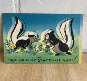 Vintage Greeting Postcard with 2 skunks- I Went out an’ got Stinkin’ Last Night! - Picture 1 of 2