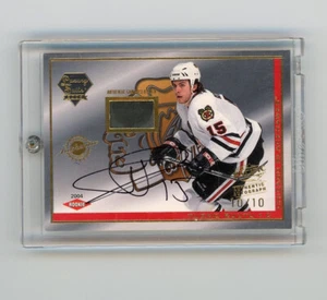 2004 PACIFIC LUXURY SUITE TUOMO RUUTU ROOKIE GAME USED PUCK PATCH RC GOLD #10/10 - Picture 1 of 2