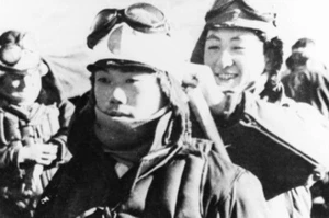 A kamikaze pilot having a Japanese flag headband tied, 1945 Japan Photo Reprint - Picture 1 of 1